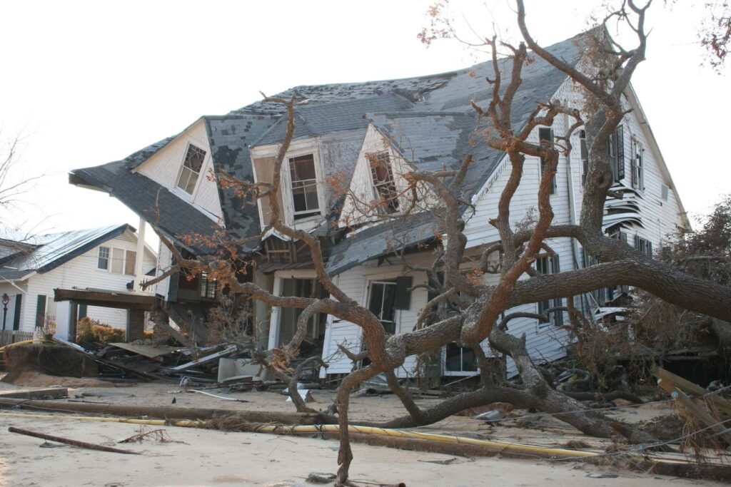 Collapsed house with downed trees and powerlines in Mississippi after Hurricane Katrina, September 2005.
